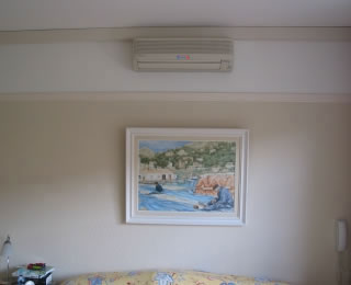 High level wall mounted split system indoor unit